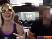 Horny blonde shows off tits in car
